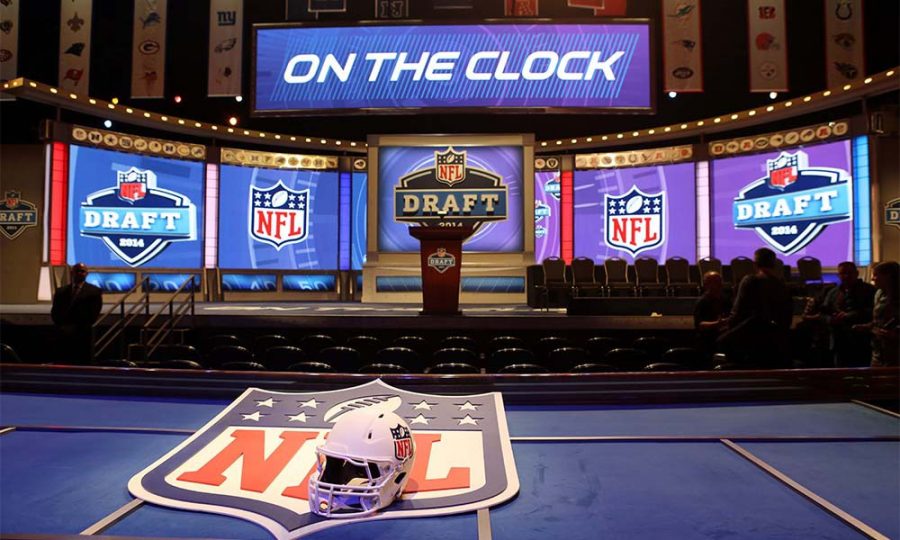 May+8%2C+2014%3B+New+York%2C+NY%2C+USA%3B+A+general+view+of+a+helmet%2C+NFL+shield%2C+stage%2C+and+podium+before+the+start+of+the+2014+NFL+Draft+at+Radio+City+Music+Hall.+Mandatory+Credit%3A+Adam+Hunger-USA+TODAY+Sports